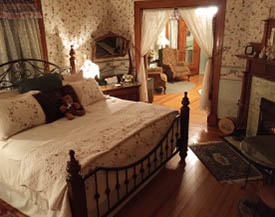 The Independence Suite features an original tile fireplace, king four-poster bed and private bath with oversized tub for two