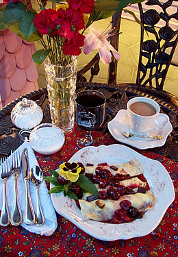 Picture with breakfast food on a small table.