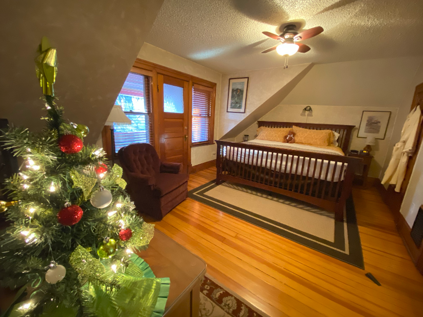 The Pikes Peak Suite offers a king bed and balcony at Holden House during the holidays